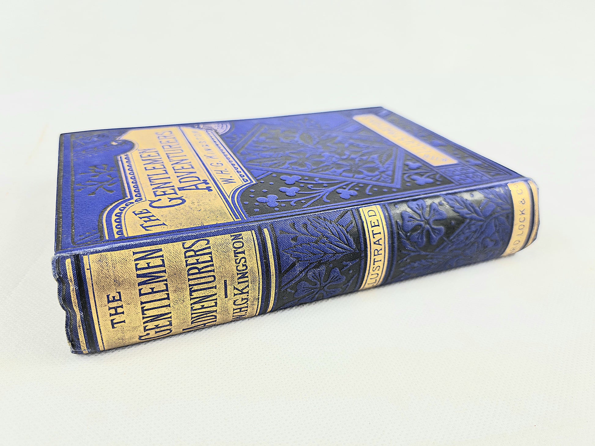 The Gentleman Adventurers. Decorative antique blue and gilt book 