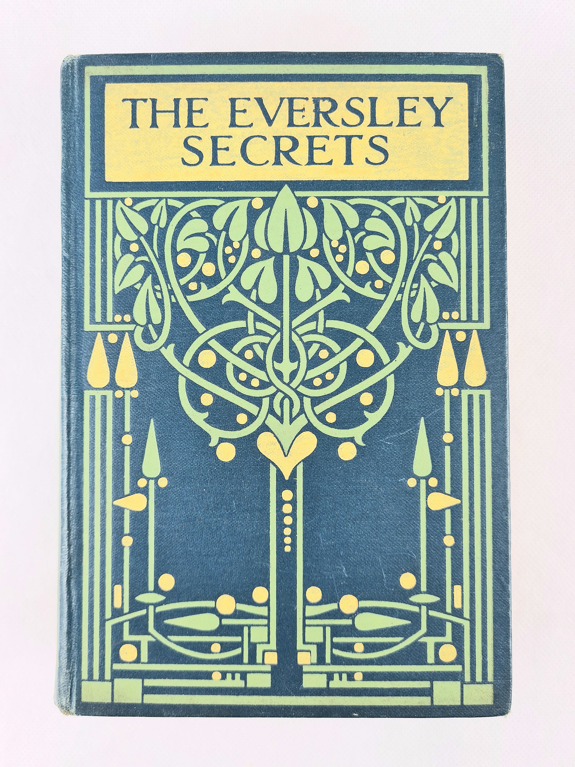 The Eversley Secrets. Decorative green antique book 