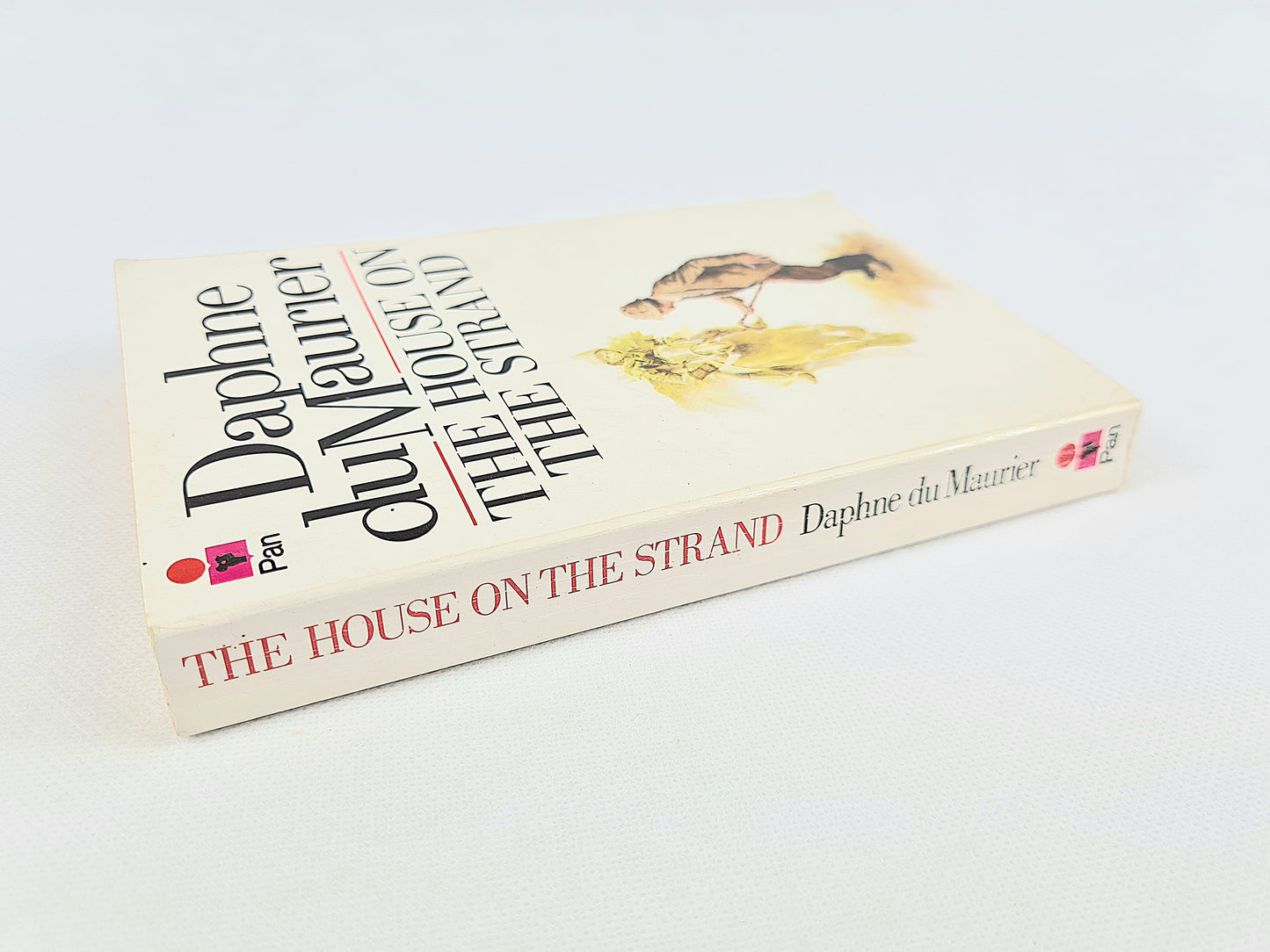 The House On The Strand by Daphne Du Maurier. Vintage paperback book. Pan Books