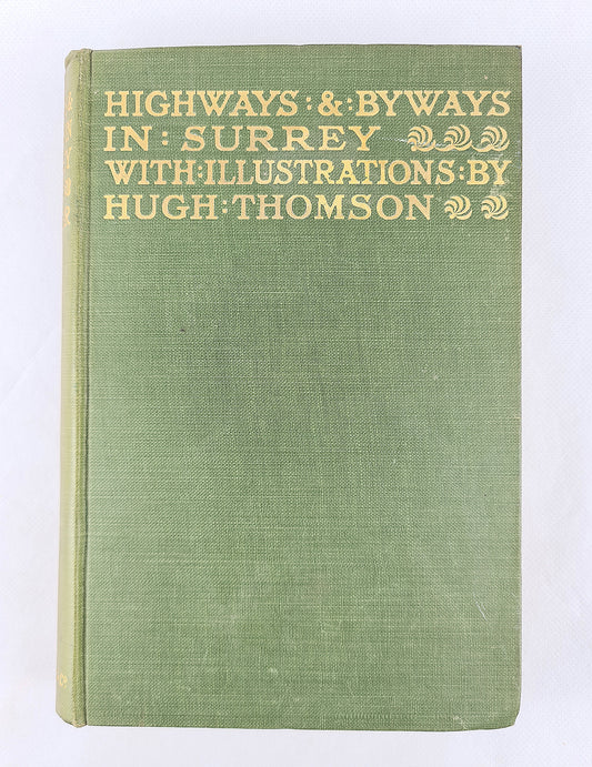 Antique green book. Travel guide for Surrey 