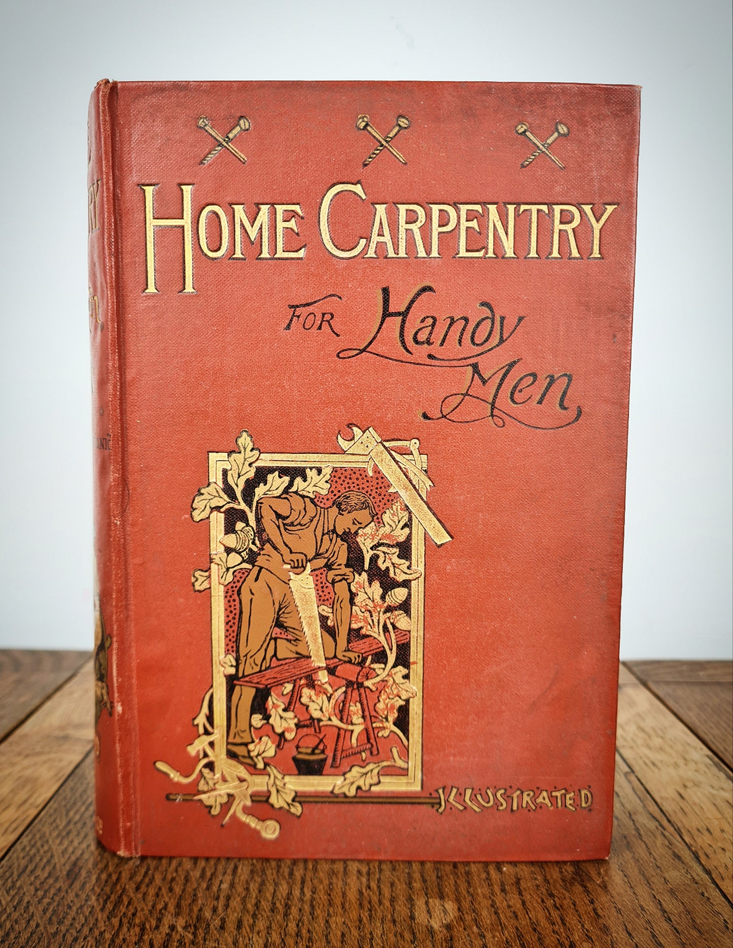 Antique Carpentry book with a decorative cover 