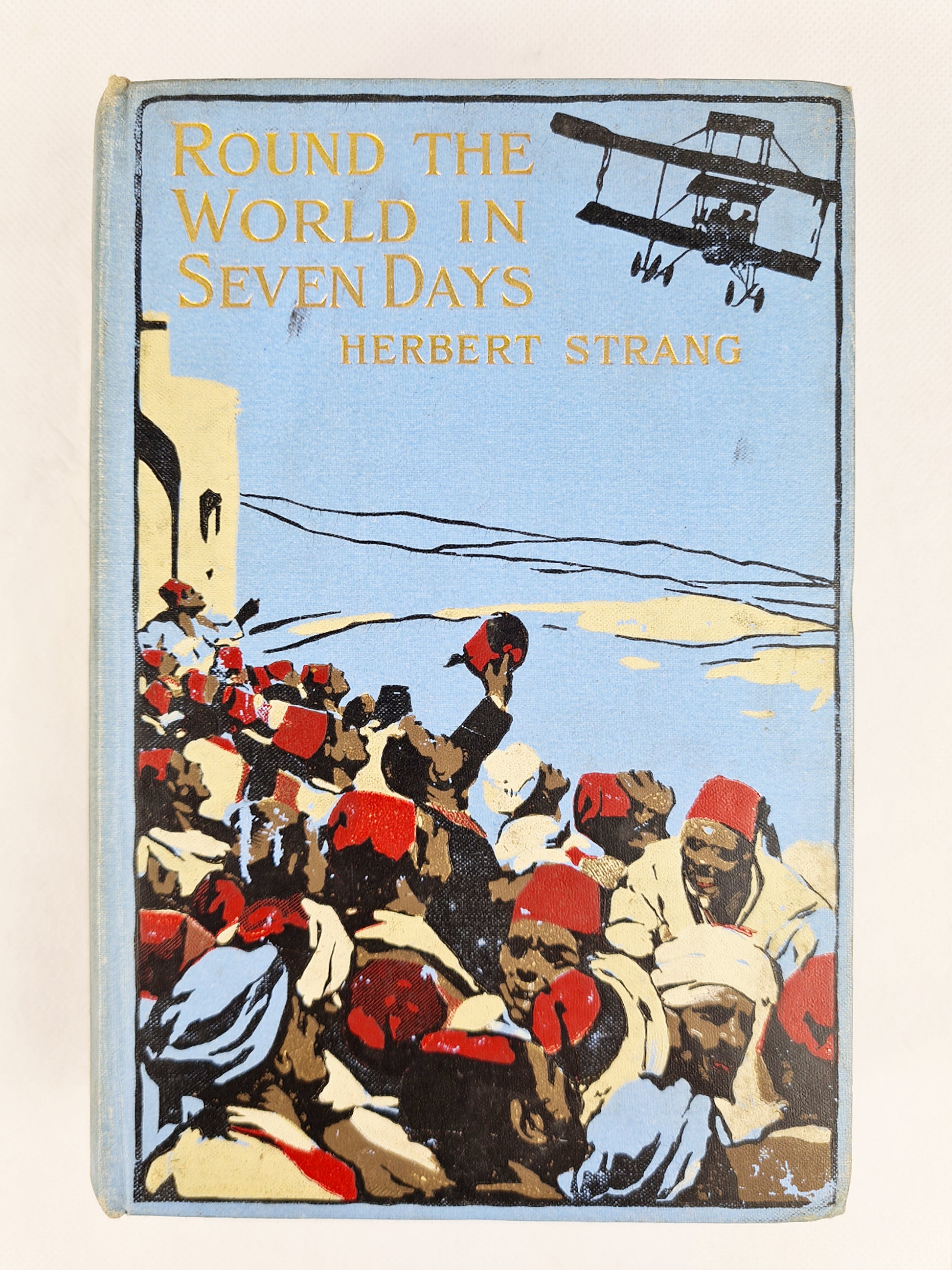 Round the world in seven days by Herbert Strang. First edition 1911