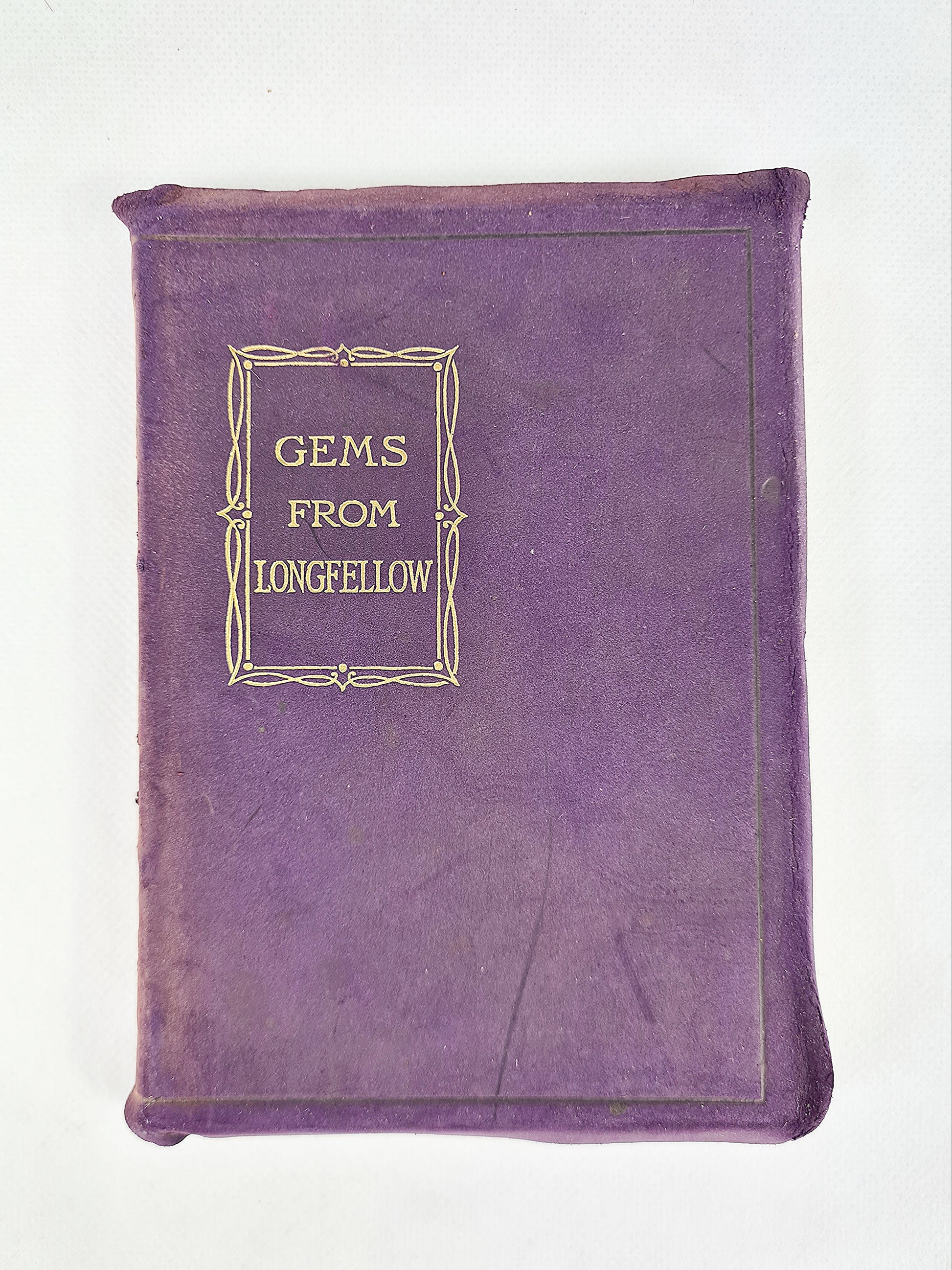 Purple antique book, poems of Longfellow